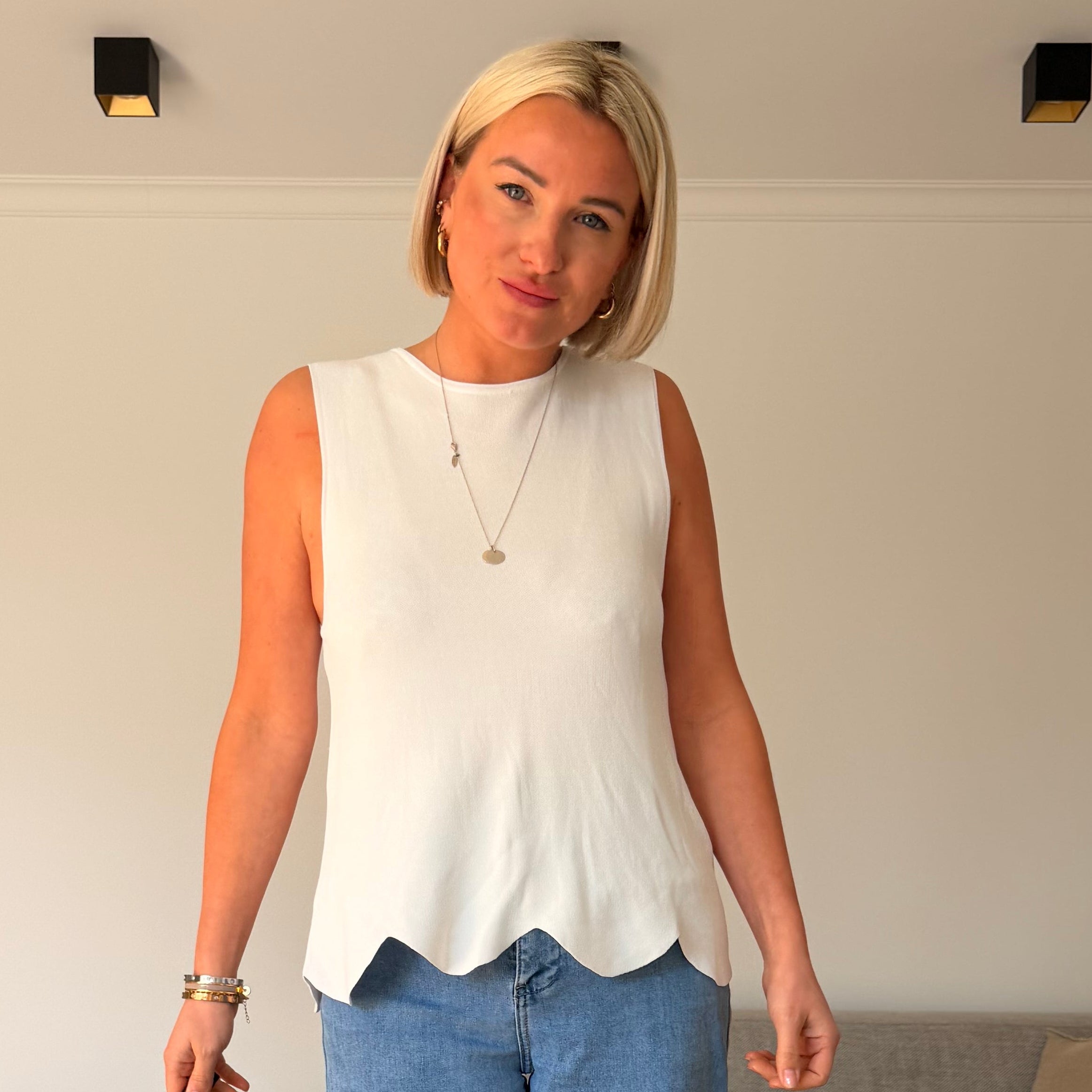 top blanc femme
top sans manches femme
top femme été
top élégant femme
top coupe évasée
look chic femme